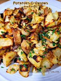 potatoes and onions on a white plate with parsley sprinkled around the edges