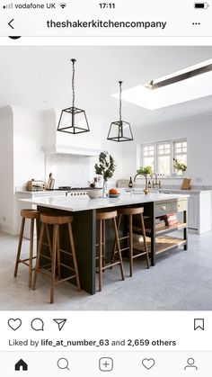 an instagram page with two stools in front of a kitchen island