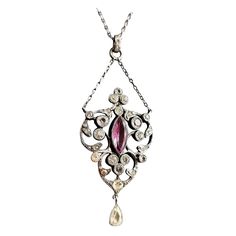 A stunning Antique Edwardian era, Belle Epoque sterling silver paste pendant necklace. It has a large pretty lavalier style pendant drop suspended from a small length of chain set with old diamond paste stones and a single Amethyst paste, the pendant has a further drop suspended from the base giving it lots of movement and sparkle. The main pendant is attached to a paste jeweled bale on the original fine link sterling silver chain. It has a spring ring fastener. A truly stunning piece of antique Victorian White Gold Pendant Necklace, Antique White Gold Pendant Necklace, Antique White Gold Necklace With Pearl Pendant, Silver Rose Cut Diamond Pendant Necklace, Silver Pendant Diamond Necklace With Rose Cut Diamonds, Silver Diamond Necklace With Rose Cut Pendant, Silver Diamond Pendant Necklace With Rose Cut, Vintage Pendant Necklace With Rose Cut Diamonds, Vintage Rose Cut Diamond Pendant Necklaces