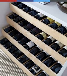 a wine rack with many bottles in it