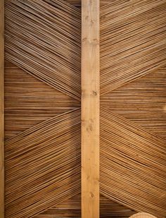 the inside of a building with wooden slatted walls