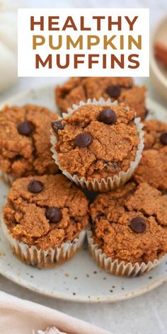 healthy pumpkin muffins on a plate with text overlay that reads healthy pumpkin muffins