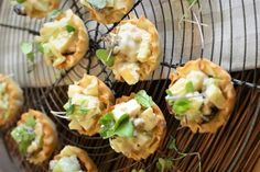 small appetizers are arranged on a wire rack