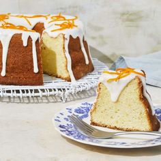 a bundt cake with orange icing on a blue and white plate