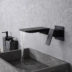 a black faucet with water running from it