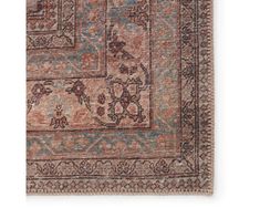 an antique rug with floral design on the front and side, in pink tones that are hand - knotted together