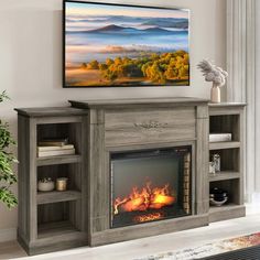 a fireplace in a living room with a painting on the wall