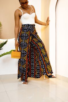 PRODUCT DETAILS: Designed in the U.S., hand-crafted in Africa Delivery within 2 weeks Multiple prints available This exceptional, multi-colored pants and skirt outfit, made of unique cotton African Ankara print fabric, will make you stand out with the pops of color and provide a nice, laid back sense of style! This unisex patchwork can be worn as evening or casual wear to various events. Model is 5'9 FABRIC CARE: Dry Clean. Hand Wash. Machine Wash. SIZE CHART: Ankara Two Piece Outfit Skirt, Wax Style African Fashion, Ankara Pencil Skirt, Ankara Skirt, Ankara Dresses, Colored Pants, Dance Outfits, African Clothing, Skirt Pants