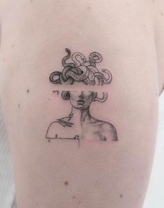 a woman's shoulder with an abstract drawing on it