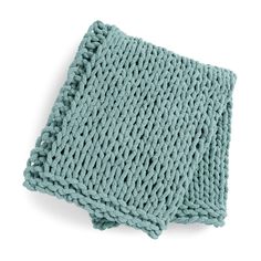 a blue knitted dishcloth on a white background