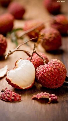 some kind of fruit sitting on top of a wooden table