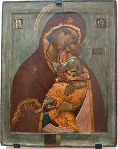 an icon of the mother and child with gold trimmings, painted on wood