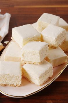 several pieces of white cake on a plate