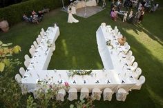 an aerial view of a wedding reception in the garden