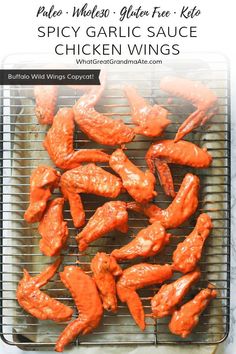 grilled chicken wings on a grill with text overlay that reads, palen gluen - free spicy garlic sauce chicken wings