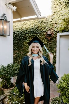 a woman wearing a graduation cap and gown