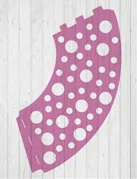 a pink and white polka dot design on wood planks with the shape of a shoe