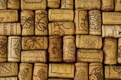 many wine corks are stacked up together