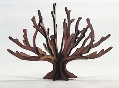 a wooden tree sculpture on a white background