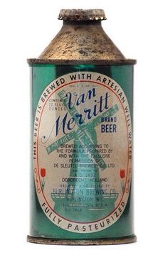 an old tin can with a windmill on the front and bottom, sitting against a white background