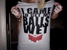 a woman wearing a t - shirt that says i came to get my balls wet