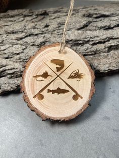 a wooden ornament with an arrow and two arrows on it