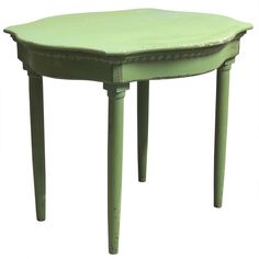 a small green table with two legs and a round shaped top on the bottom, sitting in front of a white background