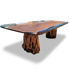 a table made out of wood and glass with an ocean theme on it's edge