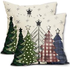 three pillows with christmas trees on them