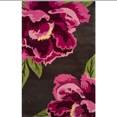 a black and pink rug with flowers on it