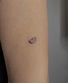 a person with a small tattoo on their arm