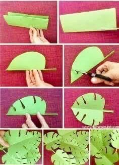 the steps to make a paper leaf with scissors and some cut out leaves on it