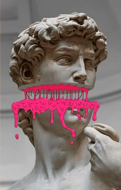 a statue with pink dripping paint on it's face