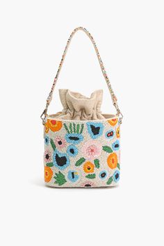 All Over Embellished bucket bag Silver-tone Hardware Drawstring fastening Metal Feet Single beaded top handle Size: 10" x 6.5" x 3.5" Step into a floral paradise with our exquisite Floral Paradise Bucket Bag, a true masterpiece of craftsmanship and elegance. This bucket bag is not just an accessory; it's a statement piece designed to captivate hearts and turn heads wherever you go.Adorned with all-over embellishments, each detail tells a story of timeless beauty and intricate artistry. The silve Summer Beaded Shoulder Bag For Daily Use, Beaded Shoulder Bag For Daily Use In Summer, Spring Beach Bags With Beaded Details, Summer Pearl Handle Pouch Shoulder Bag, Summer Pouch Shoulder Bag With Pearl Handle, Summer Beaded Pouch Bag, Summer Shoulder Bag With Pearl Handle And Pouch Shape, Spring Beach Beaded Bags, Spring Vacation Beaded Bags