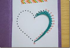 a handmade greeting card with a crochet heart