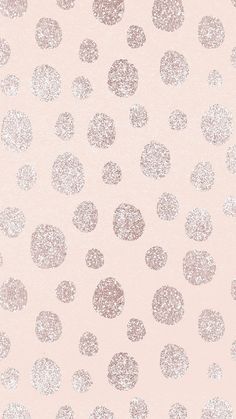 a pink background with silver dots on it