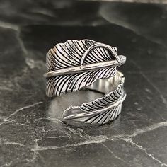 Sterling Silver Bird Feather Handmade Ring , Silver Adjustable Mystic Feather Jewelry , Lucky Leaf Ring , Hawk Feather Ring , Gift For Him , Same Day For Shipping ✧ Product Details * Handmade İtem * Gender : Male / Female * Material : 925K Sterling Silver * Ring Weight : 10 Grams ✔ Usage Details * Silver jewelry is very sensitive to chemicals. It is recommended to keep away from chemical substances such as cream, bleach, deodorant, detergent. * Silver jewelry can also darken quickly in salt water, that is, in sea water. For this reason, it is best to remove them when swimming in the sea. ✔ Shipping * Your orders placed on weekdays are delivered to the cargo on the same day. Your orders placed on the weekend are delivered to the cargo on Monday. ✔ Other Details * Our products are handmade a Hawk Feather, Hawk Feathers, Lucky Leaf, Bird Feather, Chemical Substances, Silver Bird, Feather Ring, Feather Jewelry, Leaf Ring