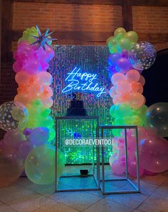 an entrance to a birthday party with balloons