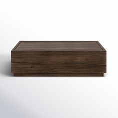 a wooden box sitting on top of a white surface