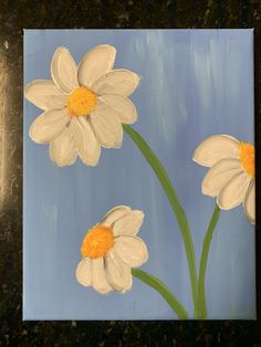 a painting of three white flowers on a blue background