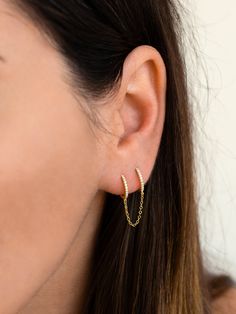 "Two dainty huggie hoops are connected by a delicate chain in this double piercing earring design. Beautiful and delicate, this cz double huggie hoop earring is absolutely perfect for those with double pierced ears. ♦ Sold singly (1 piece) or as a pair (2 pieces). * D E T A I L S * ∙ Material: .925 Sterling Silver or 18K Gold Plated over .925 Sterling Silver ∙ Outer diameter: 11.5mm - Inner diameter: 8.5mm - Chain length: 2.5cm ∙ Hypoallergenic & nickel-free * P A C K A G I N G * ∙ All jewel Double Chain Earrings, Chain Double Earrings, Double Hoop Chain Earrings, Double Pierced Ears, Rosegold Double Chain Earrings, Double Piercing Chain, Double Hoop Earring, Double Piercing Earring, Second Hole Earrings