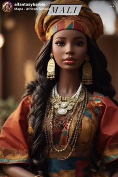 a doll is dressed in african clothing and jewelry