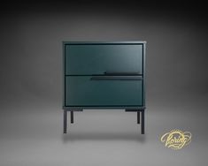 a green cabinet with two drawers on one side and a black drawer on the other