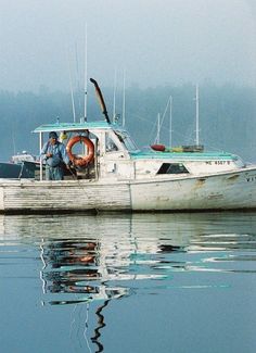 two men on a boat in the water