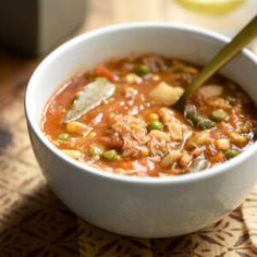 a white bowl filled with soup on top of a table