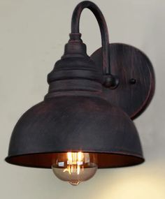 an old fashioned wall light with two lights on it