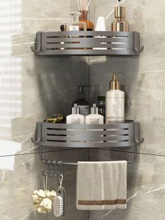 two metal shelves with towels, soaps and other bathroom items