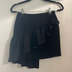 Black Mini Skirt With Ruffle From Intermix. Never Worn Before. Cute Silk Ruffle Goes Down It To The Back. Chic Ruffled Skort For Party, Ruffled Mini Skirt For Workwear, Ruffled Mini Skirt For Work, Chic Asymmetrical Ruffled Mini Skirt, Chic Ruffled Mini Skirt For Evening, Chic Ruffled Mini Skirt For Date Night, Chic Evening Mini Skirt With Ruffles, Elegant Mini Hem Skort For Party, Elegant Party Skort With Mini Hem