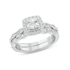 a white gold ring with diamonds on top and bottom, in the shape of a square diamond