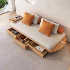 a living room with a couch, coffee table and bookshelf on the floor